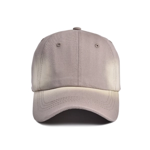 Detail of a vintage-style six-panel baseball cap showing tie-dye gradient and stitching
