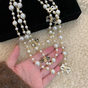 French vintage multilayer pearl necklace with black and white enamel bow charms