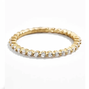 Macro shot of gold S925 sterling silver eternity ring with sparkling CZ pavé stones
