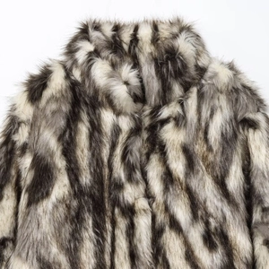 Faux fur coat featuring black, grey, and white striped patterns with fluffy texture