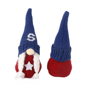 Close-up of handmade July 4th gnomes with knitted USA patterns and white star details