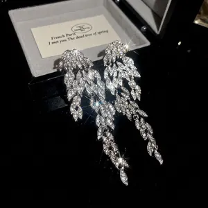 Elegant silver tassel earrings with leaf-shaped sparkling crystals for luxury formal wear