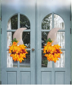 Detail of harvest gnome wreath with maple leaf beard and sunflower hanging on door