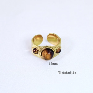 Detailed macro shot of vintage 14k gold plated tiger eye ring with 12mm center stone