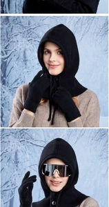 Close-up of black knitted balaclava with button design and matching winter gloves