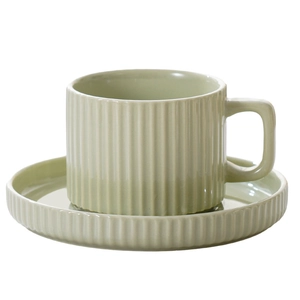 Minimalist light green ceramic coffee cup and saucer set with elegant vertical stripes