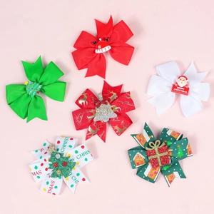 Detail of Christmas bow clips with Santa, tree, and reindeer prints on pink background