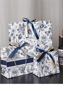 Three-piece set of floral gift bags with blue satin bows and Happy Time text detail