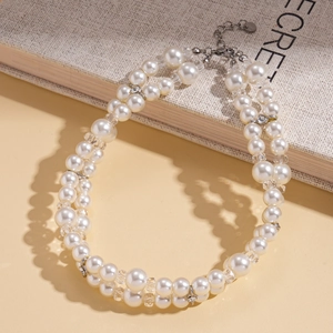 Detail of elegant double-layered pearl and crystal necklace with silver lobster clasp