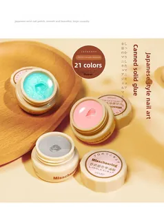 Macro view of 21-color solid cream nail polish texture in small cosmetic jars