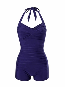 Detail of purple halter neck one-piece swimsuit featuring ruched bust and sweetheart neckline