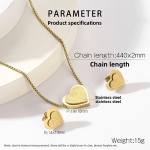Detail view of gold heart jewelry set with necklace and earrings size specifications