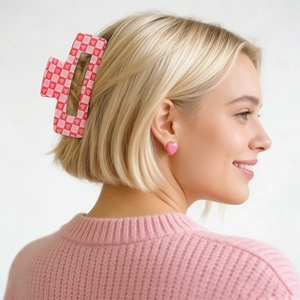 Detail of pink and red checkered heart hair claw clip on model for Valentine's Day