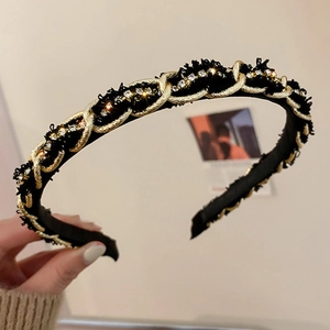 Elegant black velvet headband with gold chain and crystals in a vintage style