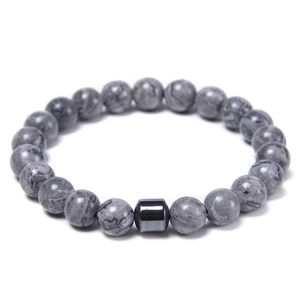 Detailed view of 8mm gray stone beads and a black cylindrical metal bead on a men's bracelet