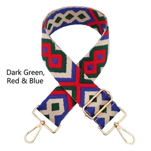 Close-up of geometric diamond pattern embroidery on dark green ethnic bag strap
