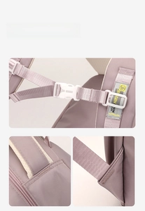 Detail of adjustable chest buckle and reinforced stitching on girls pink backpack
