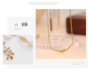 Macro view of gold smile pendant necklace with sparkling micro-inlaid cubic zirconia