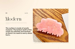 Macro detail of a pink acrylic cloud hair claw clip with matte marble texture finish