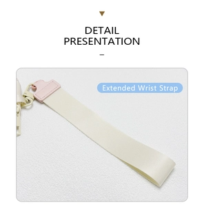 Detail view of the extended beige nylon wrist strap with pink leather and plastic hook