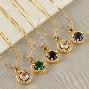 18K gold plated stainless steel necklaces with colorful zircon pendants on marble surface