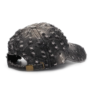 Vintage washed black denim baseball cap with distressed ripped holes and metal buckle