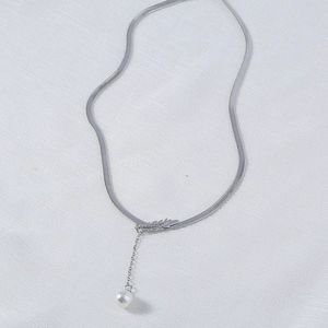 Elegant silver snake chain necklace with leaf feather pendant and pearl drop detail