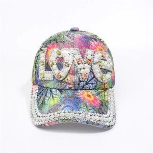 Detail of colorful floral print baseball cap with pearl and rhinestone LOVE letters decoration