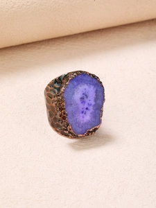 Macro detail of purple druzy crystal cluster with vintage hammered wide bronze band