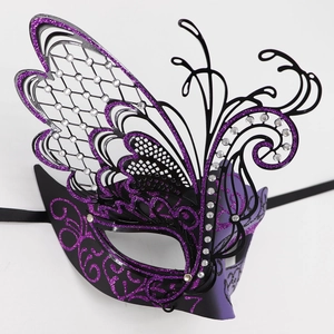 Macro view of purple butterfly masquerade mask with glitter and rhinestone details