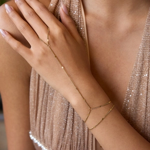 Elegant gold finger bracelet with delicate chain and ring set for women in stainless steel