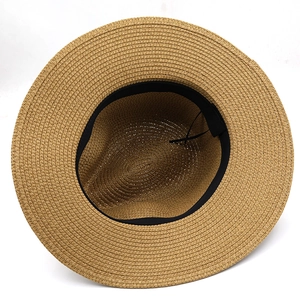 Detail of internal black sweatband and adjustable drawstring inside the straw hat