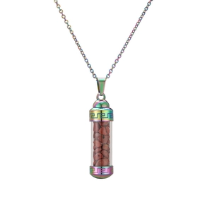 Detail of rainbow stainless steel perfume bottle pendant filled with red crystal gravel