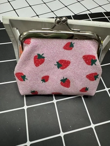 Pink sequin coin purse with strawberry print and metal kiss-lock closure for daily use