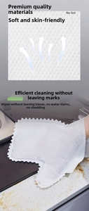 Macro detail of breathable non-woven cleaning glove wiping a marble kitchen countertop