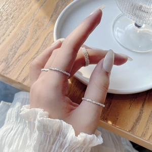 Detailed view of silver stackable minimalist rings with sparkling textured finish