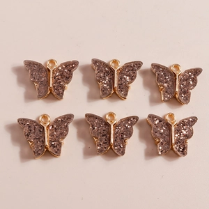 Brown butterfly charms with gold metal frame and glitter flakes in 2x3 grid display