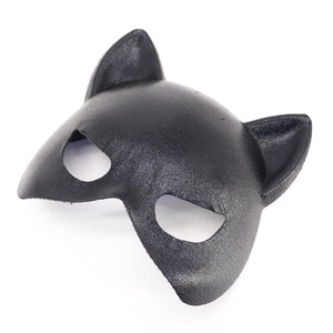 Detailed close-up of the black leopard texture grain on the cat-shaped masquerade mask
