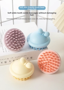 Detail of soft silicone massage bristles and decorative bow handle on hair wash brushes