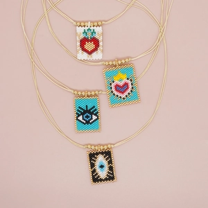 Bohemian woven seed bead pendant necklaces with heart and evil eye patterns