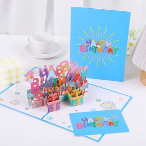 Detailed view of a 3D pop-up birthday card set featuring colorful letters and gift boxes