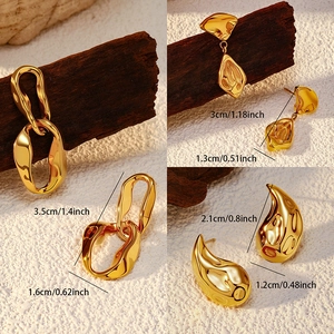 Detailed view of three gold titanium steel earrings with sizes and wave textures