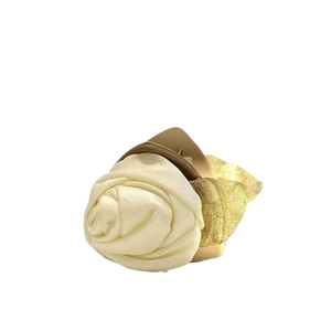 Elegant medium hair claw clip featuring beige camellia flower and gold lace bow detail