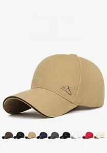 Detailed close-up of mountain peak embroidery on a khaki structured cotton baseball cap