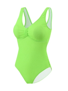 Détail du tissu côtelé vert néon et décolleté en V froncé sur le maillot de bain