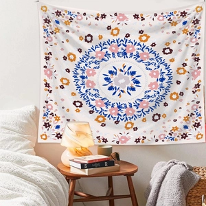 Cozy bedroom setting with mandala wall tapestry hanging over a bed in soft colors