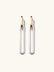 Detailed view of two-tone gold and silver dangling earrings with detachable oval links
