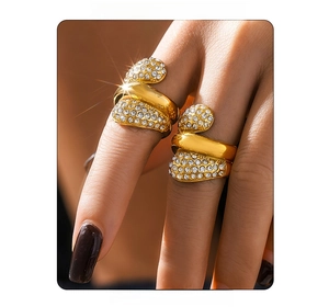 Macro detail of multilayered 18K gold plated ring with pavé-set shimmering zircon stones