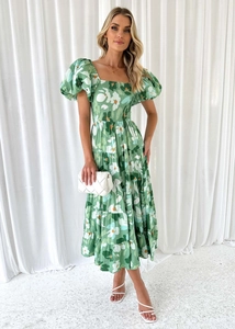 Abito midi verde a fiori con scollo a barca, maniche a sbuffo e gonna a balze