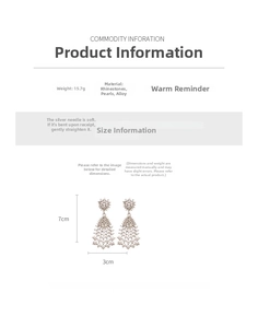 Detailed dimensions of silver tassel earrings with pearls and rhinestones measuring 7x3cm